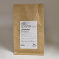 Well Roasted Coffee 200g bag of Colombian coffee beans, white label on a brown kraft bag