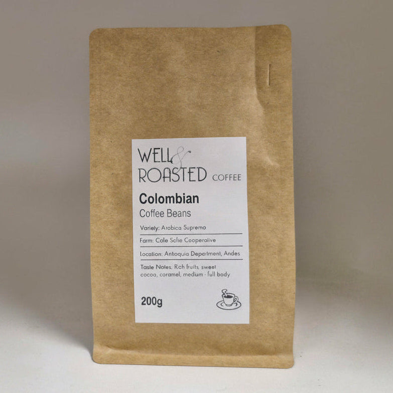Well Roasted Coffee 200g bag of Colombian coffee beans, white label on a brown kraft bag