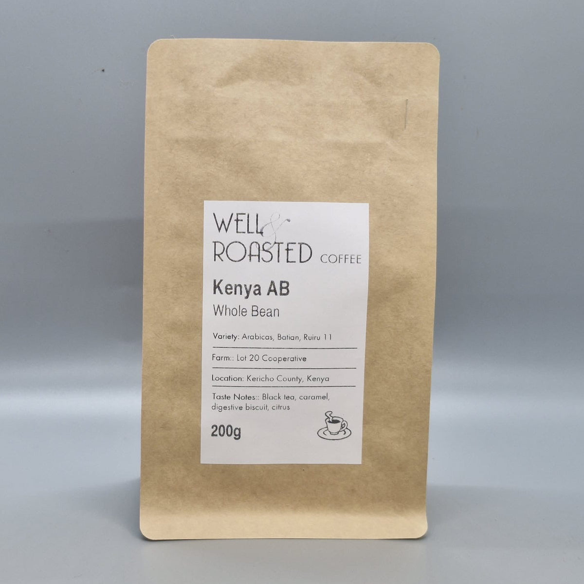 A 200g bag of Well Roasted Coffee Kenya AB whole bean in a brown kraft paper pouch with a white label, set against a neutral grey background.