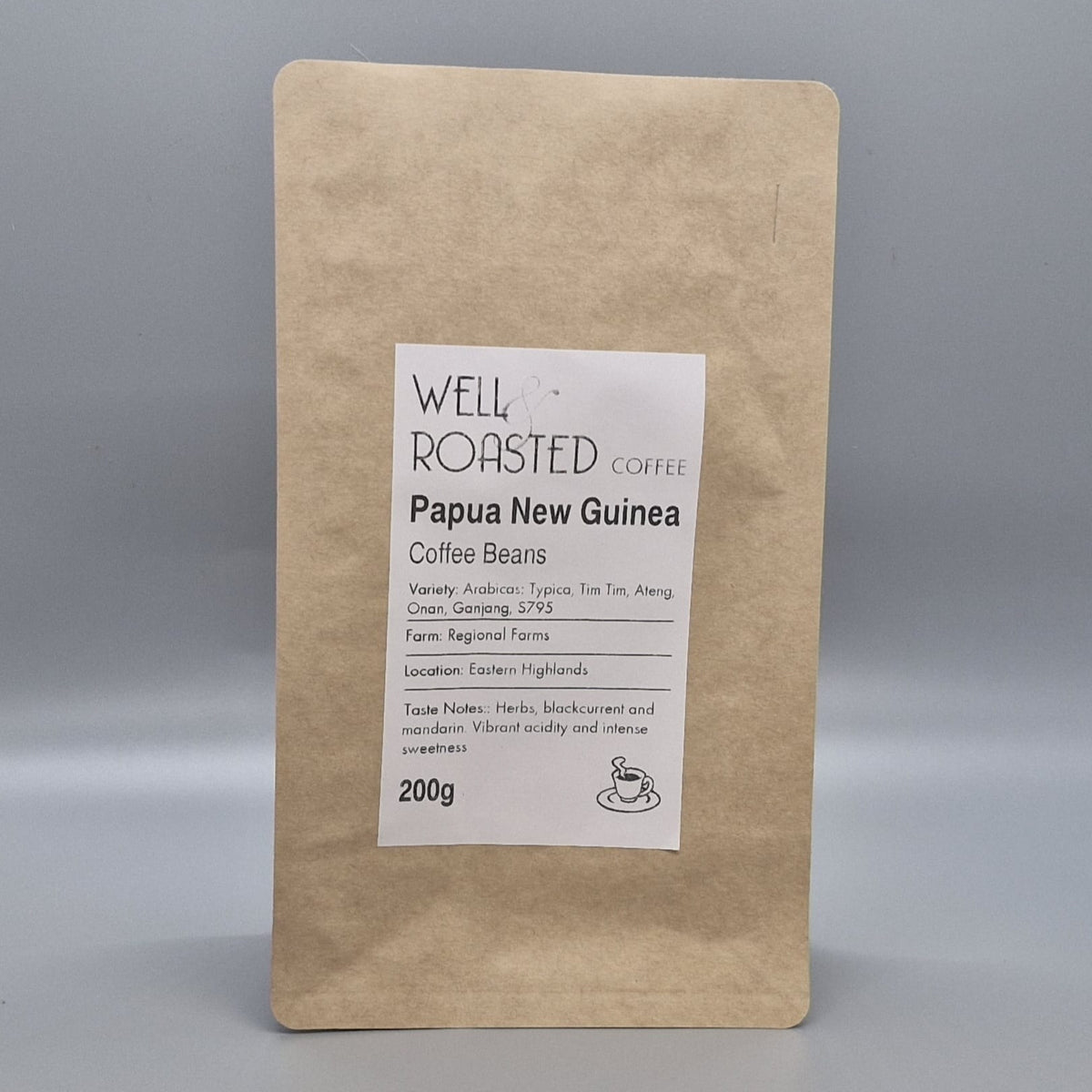 image of Well Roasted Coffee brown kraft coffee bag 200g of Papua New Guinea coffee beans, with a grey studio background