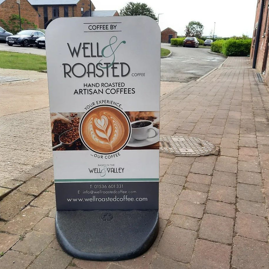 Well Roasted Coffee pavement sign at our roastery